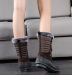 Brown lace-up mid-calf snow boots with faux fur collar and rubber heel outsole