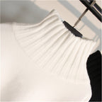 White oversized knit turtleneck sweater with drop-shoulder balloon sleeves