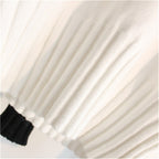 White knit turtleneck sweater with ribbed hem and cuffs
