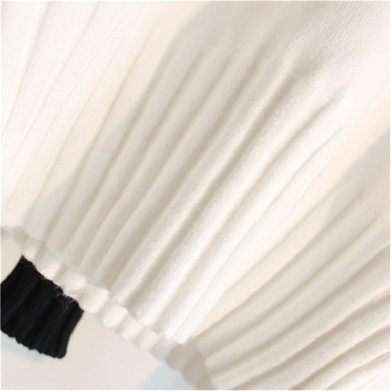 White knit turtleneck sweater with ribbed hem and cuffs