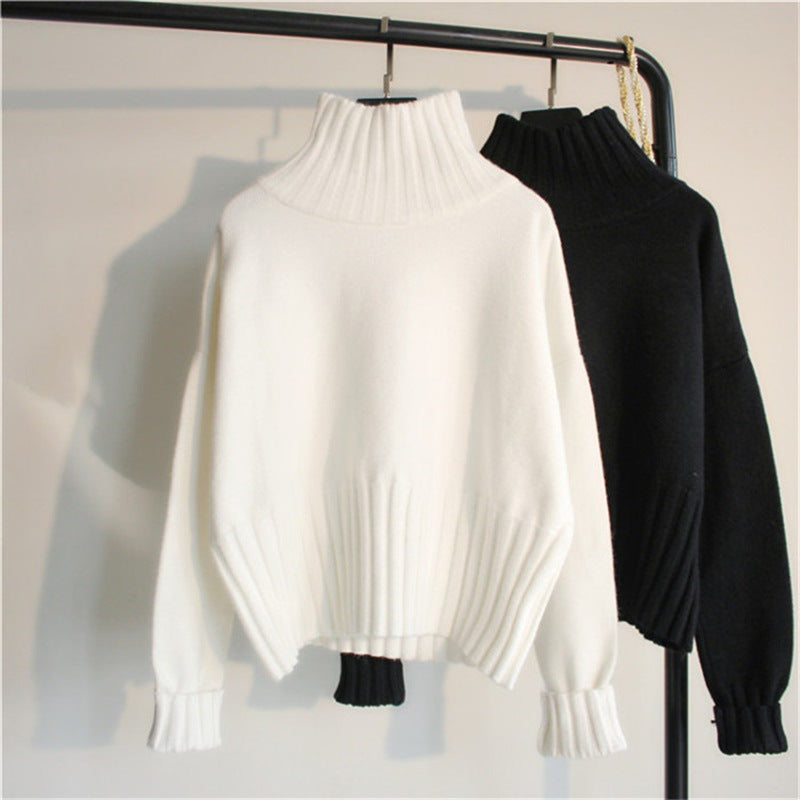 White and black ribbed turtleneck knit sweaters with balloon sleeves