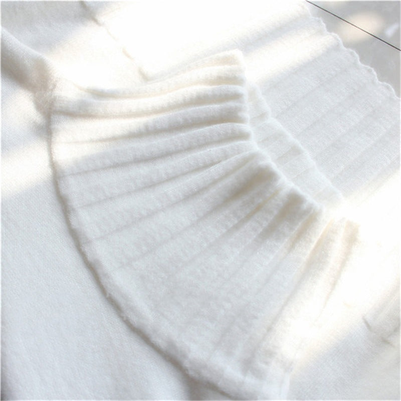 White ribbed turtleneck sweater neckline with vertical knit texture