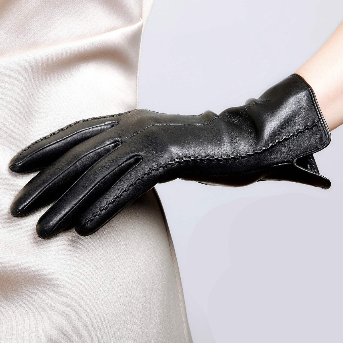 Women’s black leather dress gloves with whipstitch trim and vented cuff