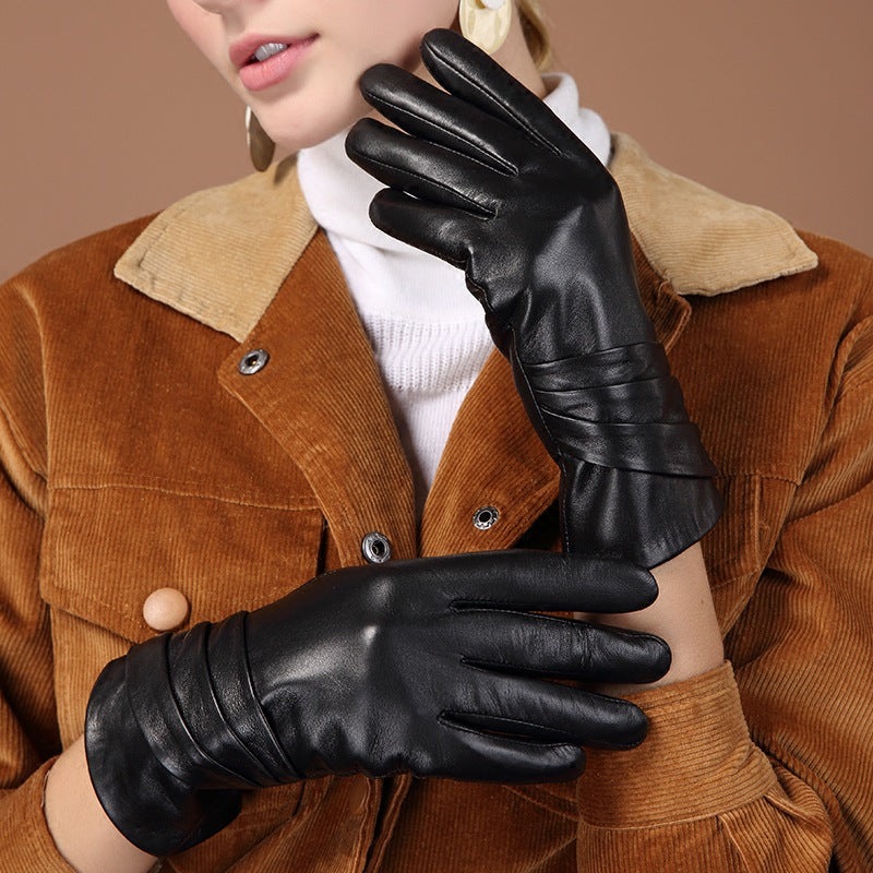 Black leather women’s gloves set, one palm and one back view with pleated cuff
