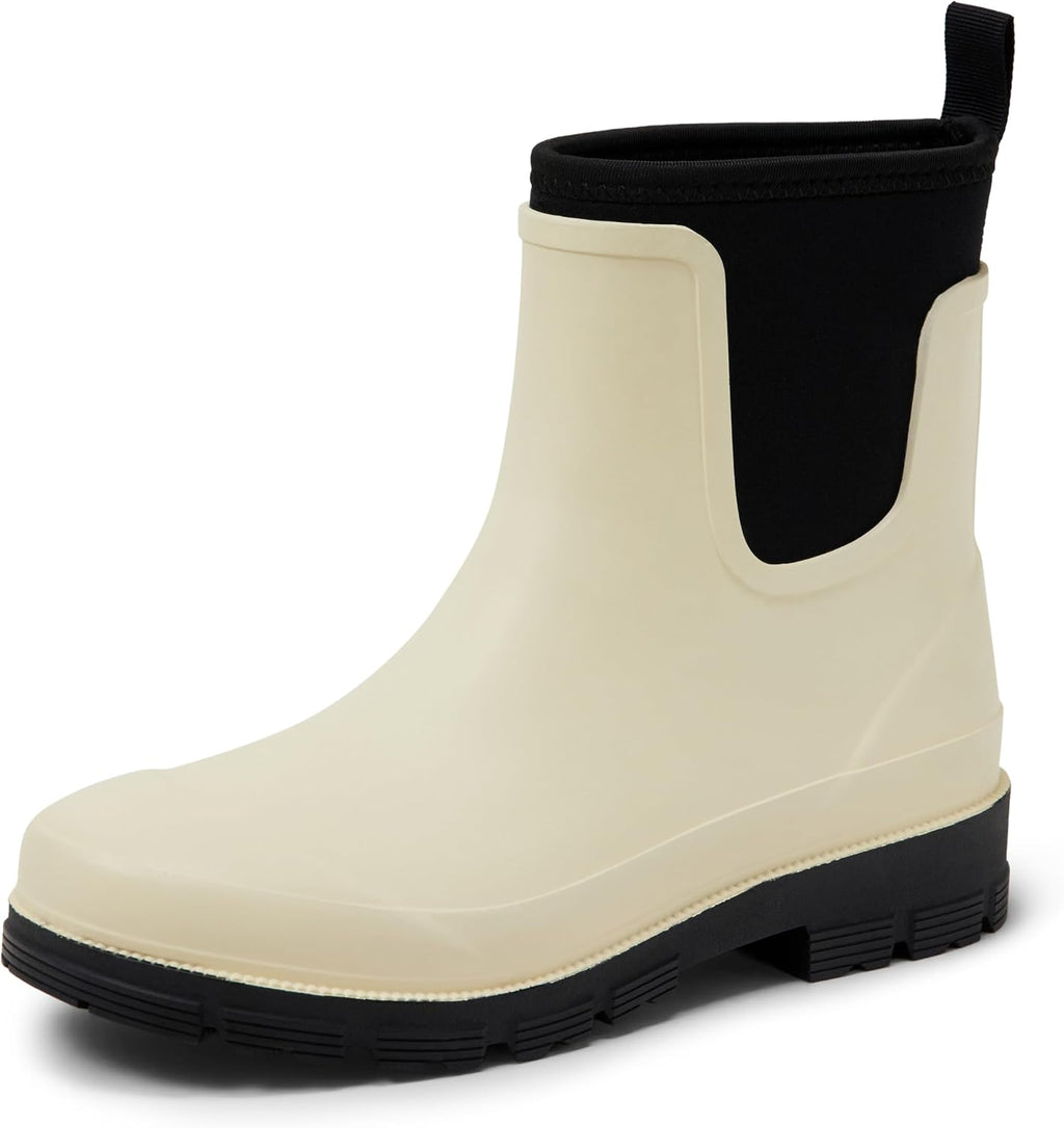 Ivory Chelsea ankle rain boot with elastic gore and black lugged rubber sole