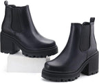 Black Chelsea ankle boots with pull tabs, chunky block heels, and lug soles