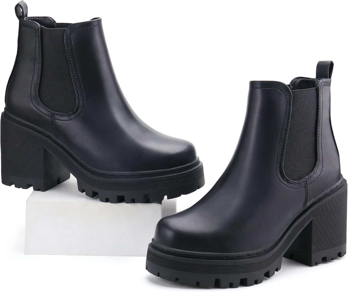 Black Chelsea ankle boots with pull tabs, chunky block heels, and lug soles