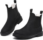 Matte black faux fur lined Chelsea ankle boots with elastic gussets and lug soles