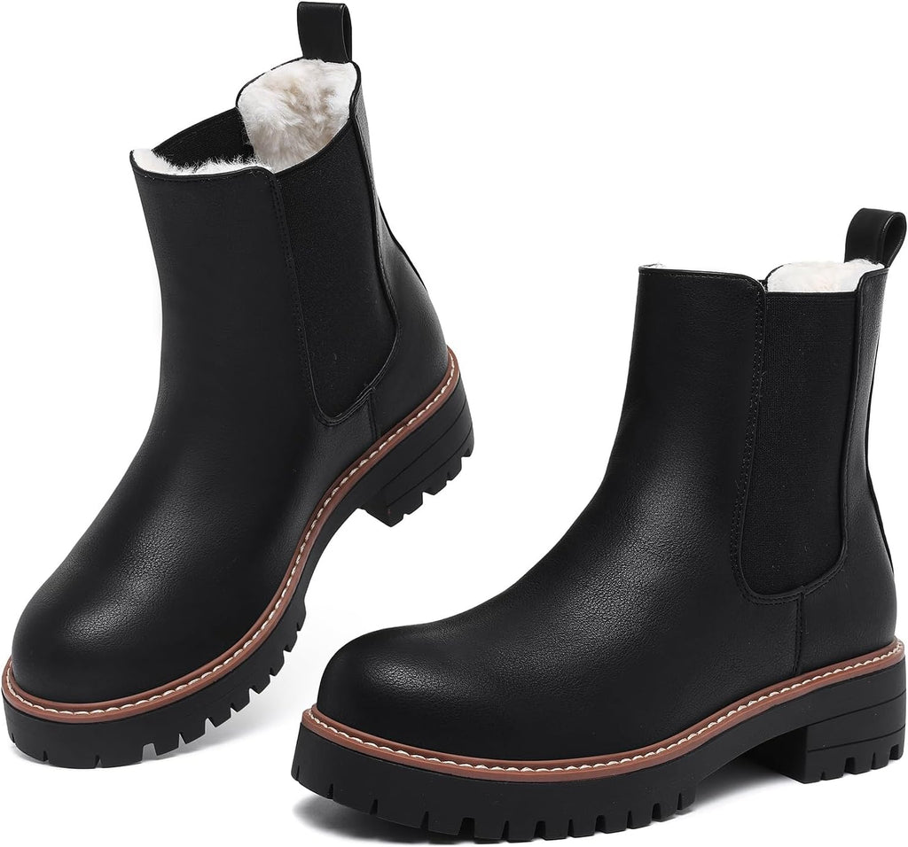 Black faux leather Chelsea ankle boots with faux fur lining, contrast welt and chunky lug soles
