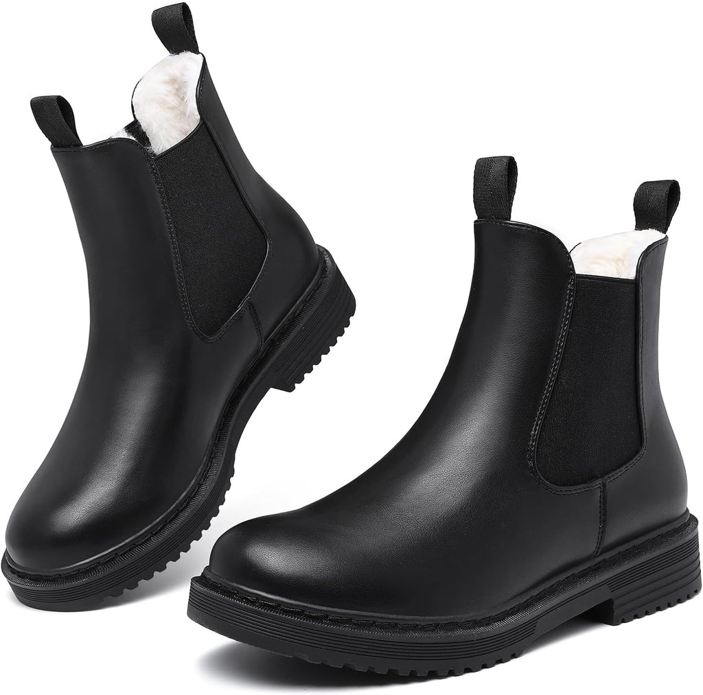 Black faux fur lined Chelsea ankle boots with elastic gussets, pull tabs, and lug soles