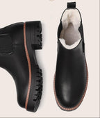 Black Chelsea boot top view showing plush lining and lug sole tread