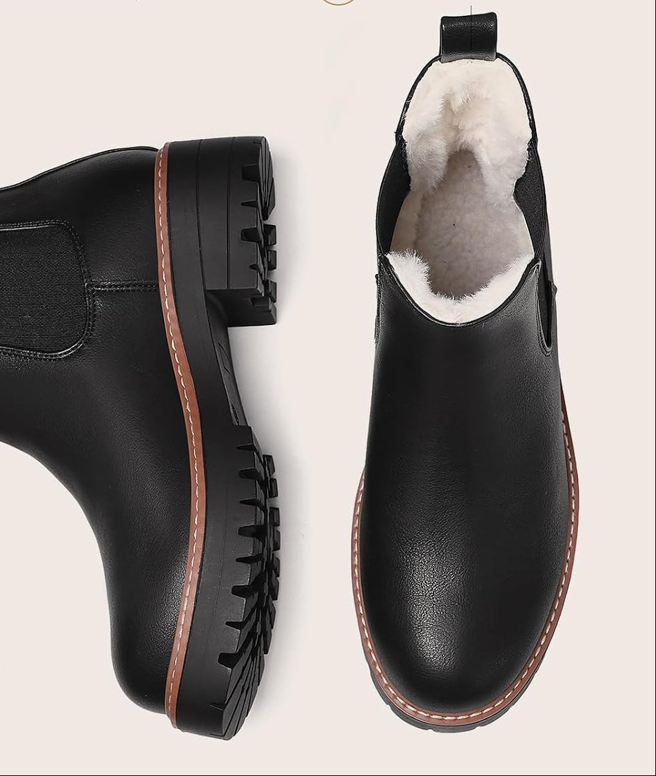 Black Chelsea boot top view showing plush lining and lug sole tread