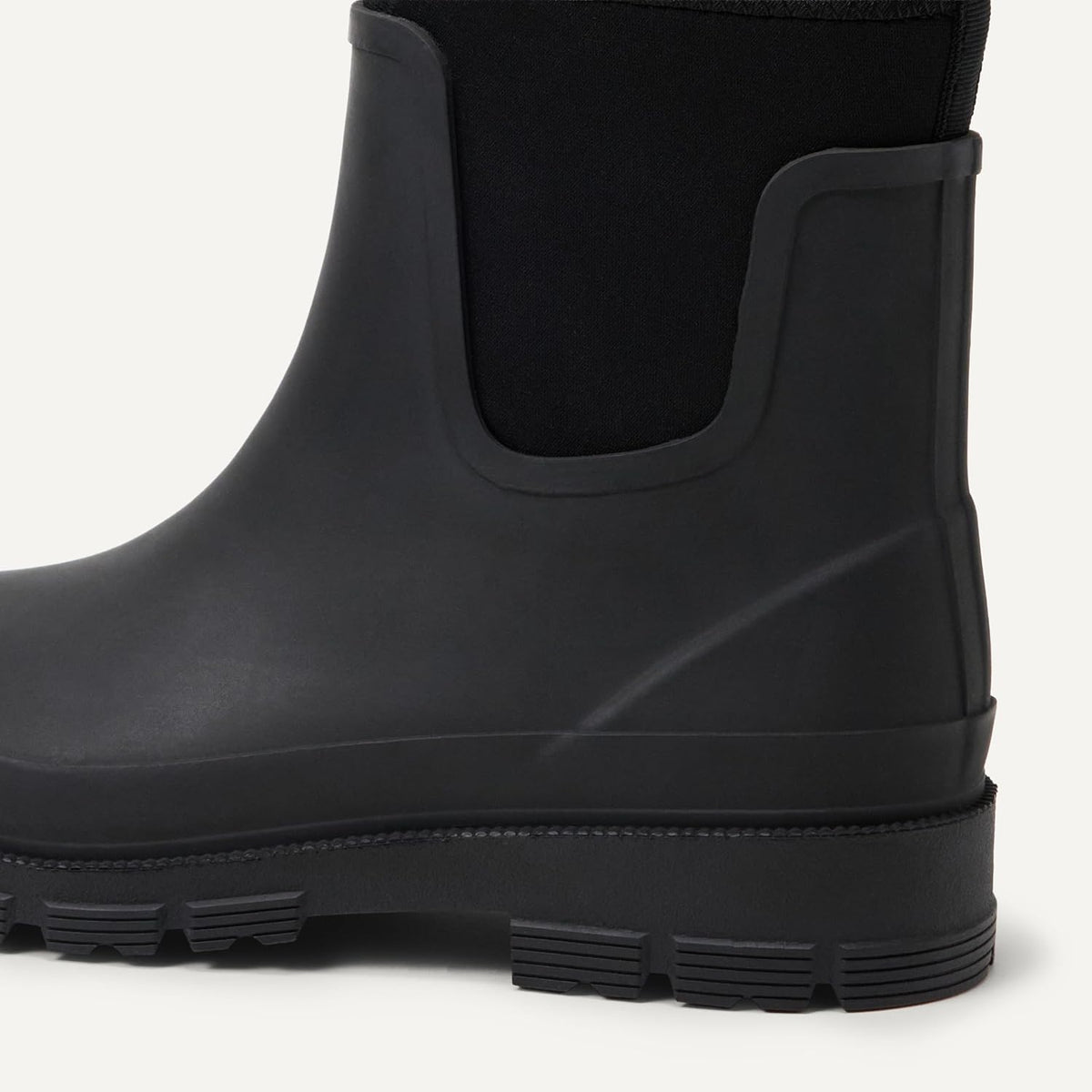 Black Chelsea ankle rain boot with elastic gore and treaded rubber sole