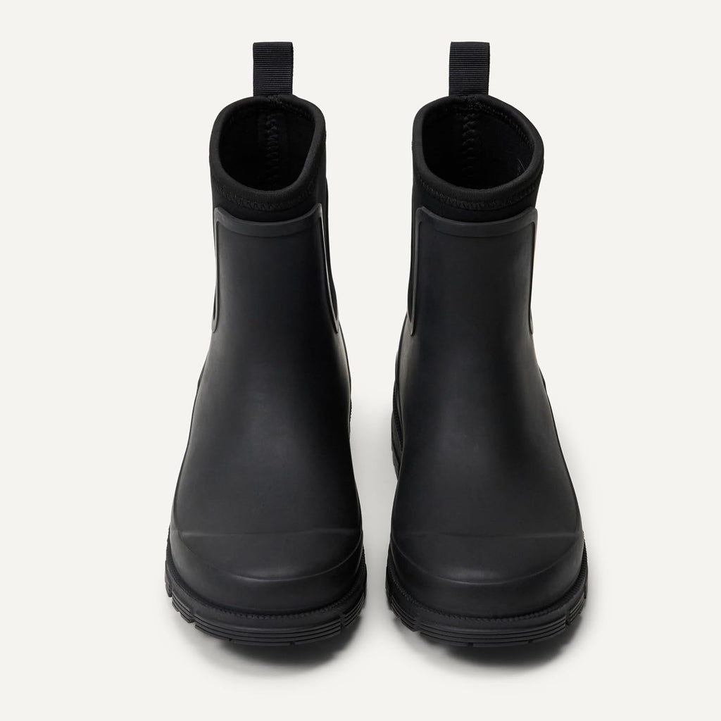Pair of black Chelsea ankle rain boots with elastic side panels and rounded toe
