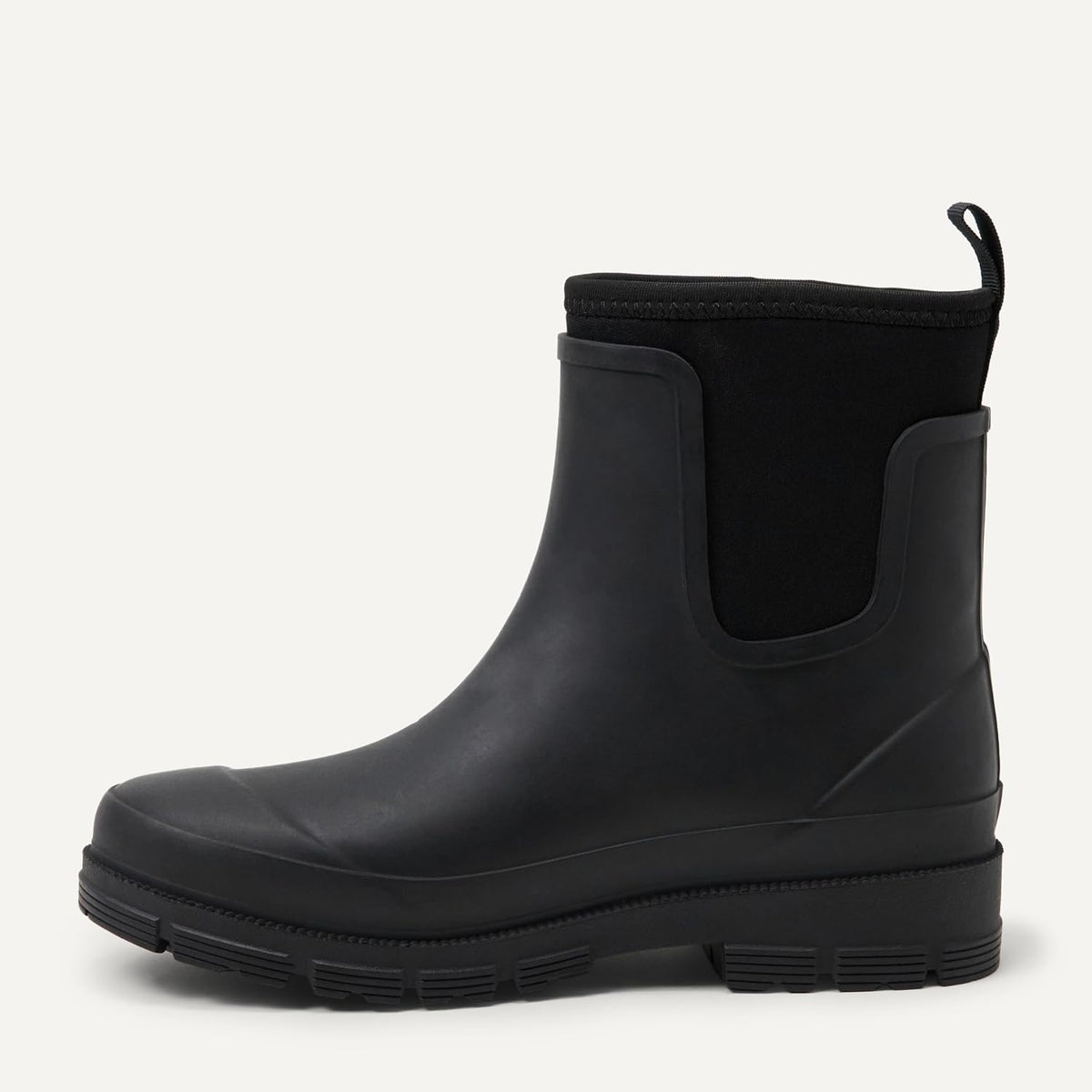 Black Chelsea ankle rain boot with pull tab, elastic gore, and lug tread sole