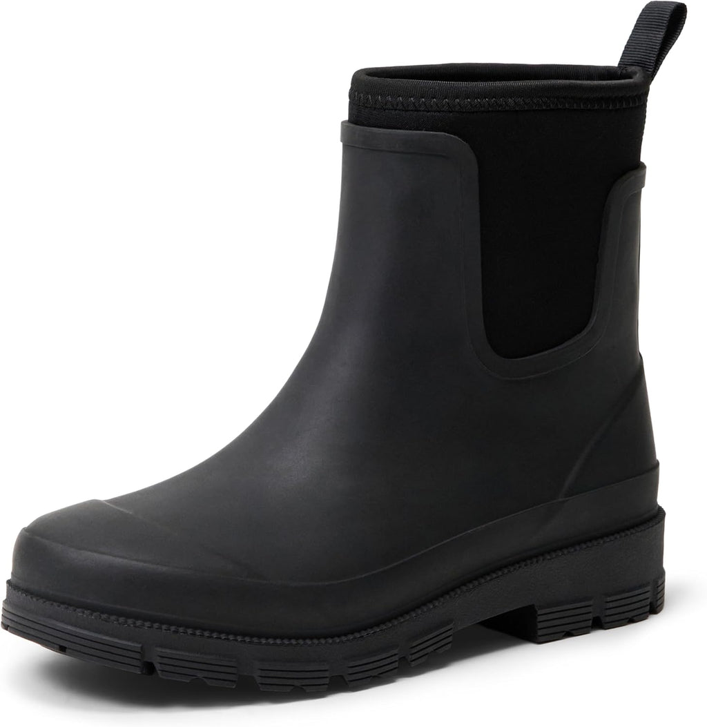 Black Chelsea ankle rain boot with elastic side gore, pull tab, and rubber tread sole