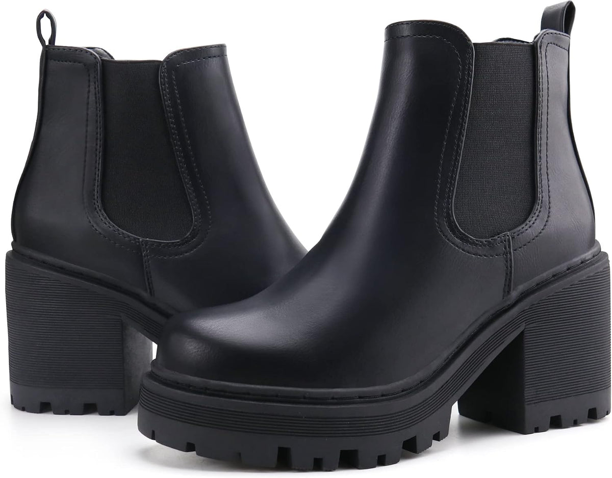 Pair of black faux leather Chelsea ankle boots with elastic panels and lug soles