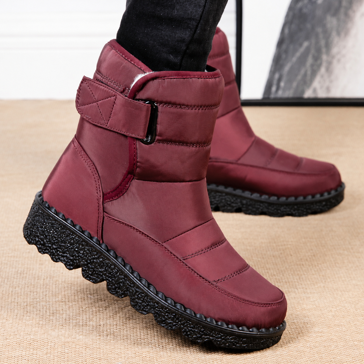 Wine red quilted platform snow boots with side strap, padded collar, and ridged outsole.