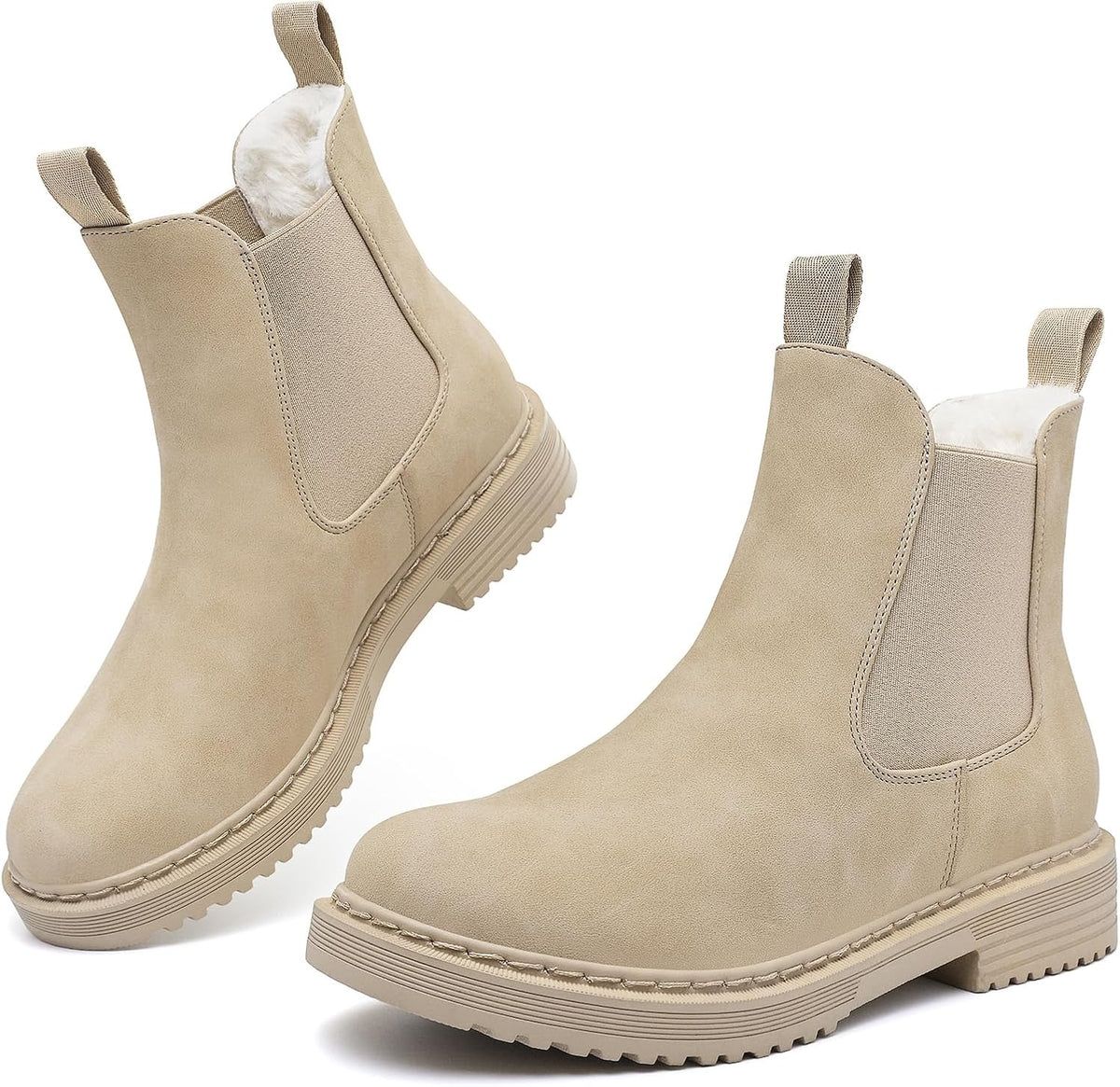 Beige faux fur lined Chelsea ankle boots with elastic gussets, pull tabs, and lug soles