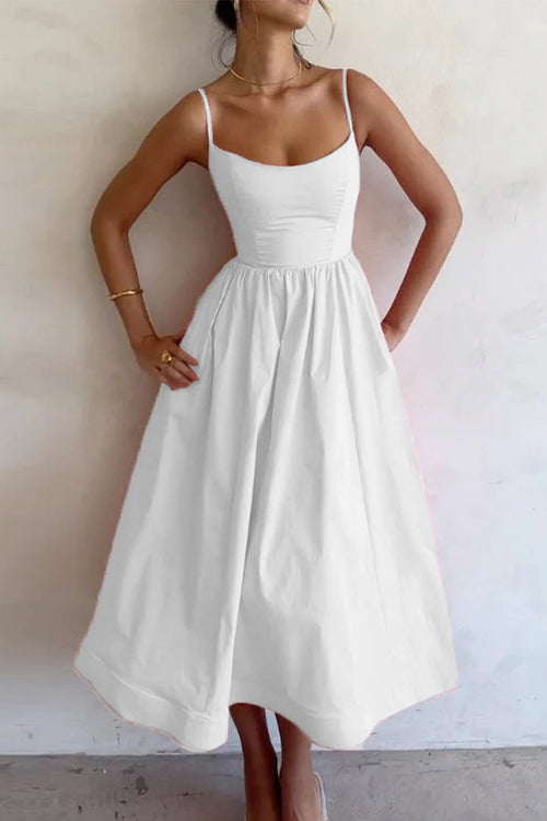 White sweetheart midi dress with spaghetti straps and gathered waist flared skirt
