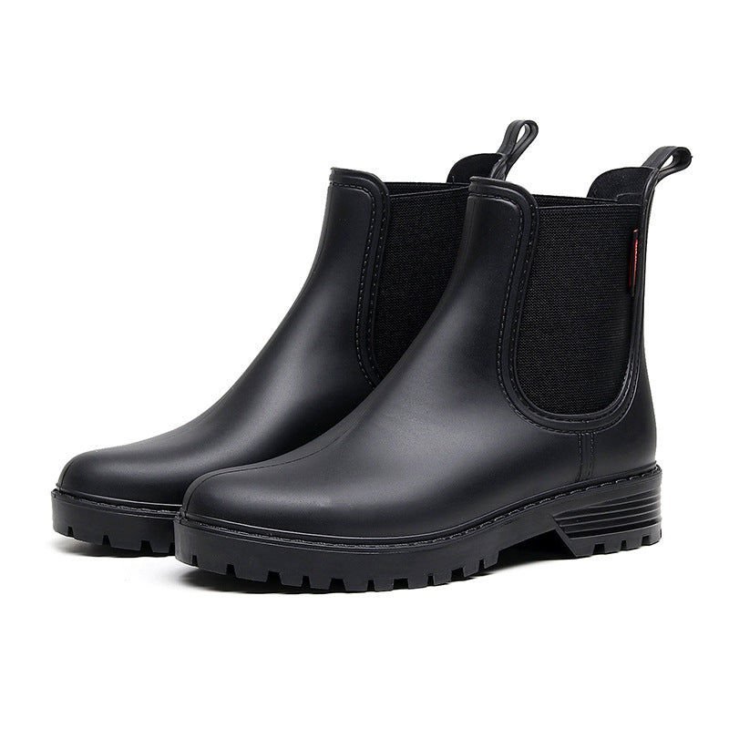 Women's black chelsea rain boots, elastic gore panels, thick lug rubber sole