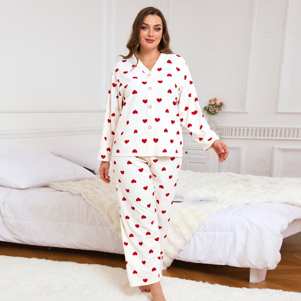 Women’s heart-print pajama set, white long-sleeve button top and matching pants with red hearts