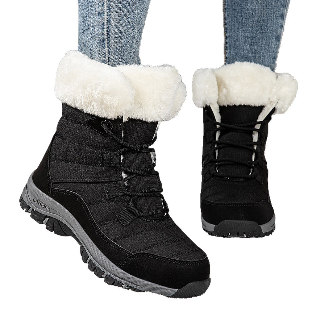 Women’s black lace-up snow boots with faux-fur cuffs and textured lug outsole