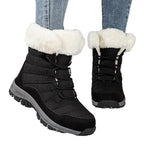 Women’s black lace-up snow boots with faux-fur cuffs and textured lug outsole