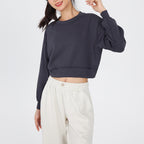 Dark cropped crewneck sweatshirt with drop-shoulder long sleeves and ribbed hem