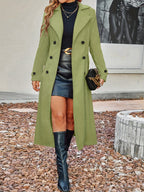 Light green long wool coat with notch lapels, double-breasted buttons and a tailored waist