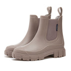 Chelsea rain boots in taupe matte rubber with side elastic panels and chunky lug sole.