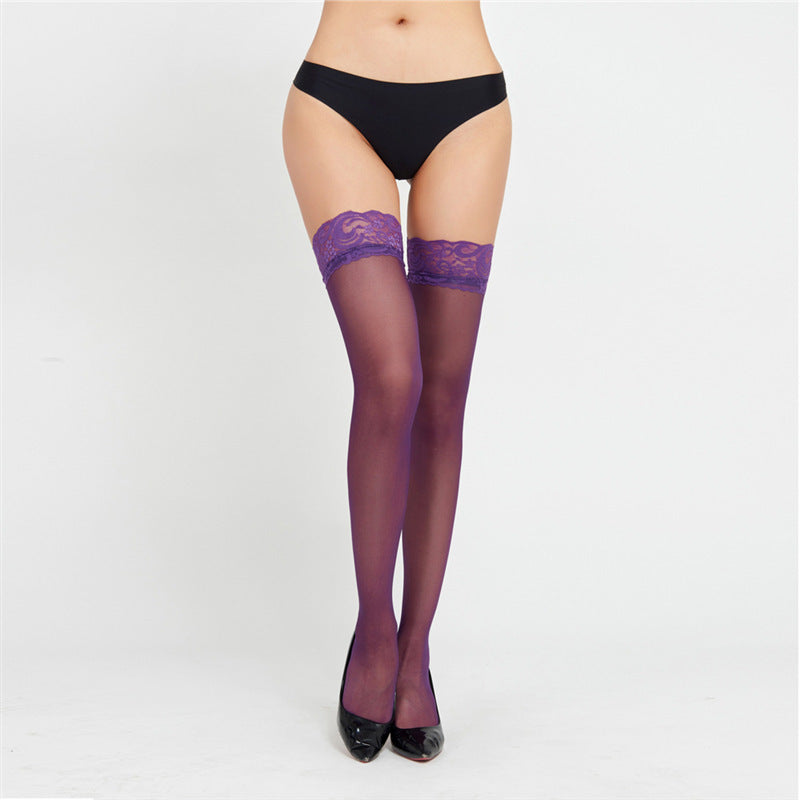 Purple sheer thigh-high stockings with lace tops, matching brief set shown