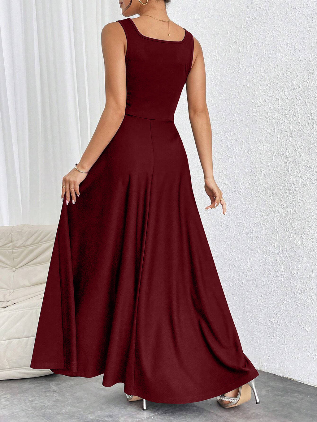 Burgundy sleeveless long dress with square back and pleated flared skirt