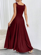 Burgundy sleeveless long dress with square back and pleated flared skirt