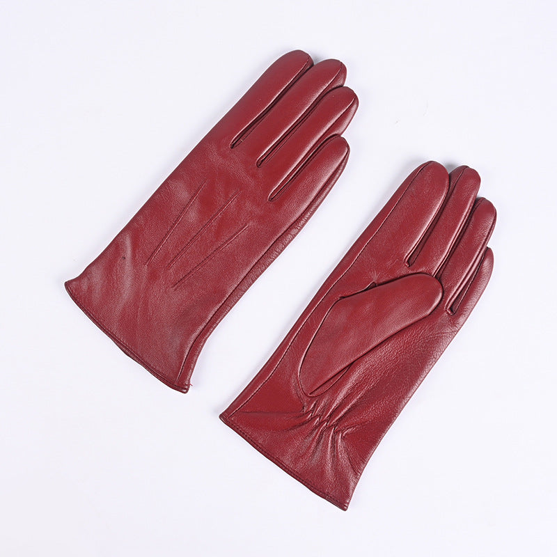 Women's red leather winter gloves pair, fleece-lined, three-panel stitched design