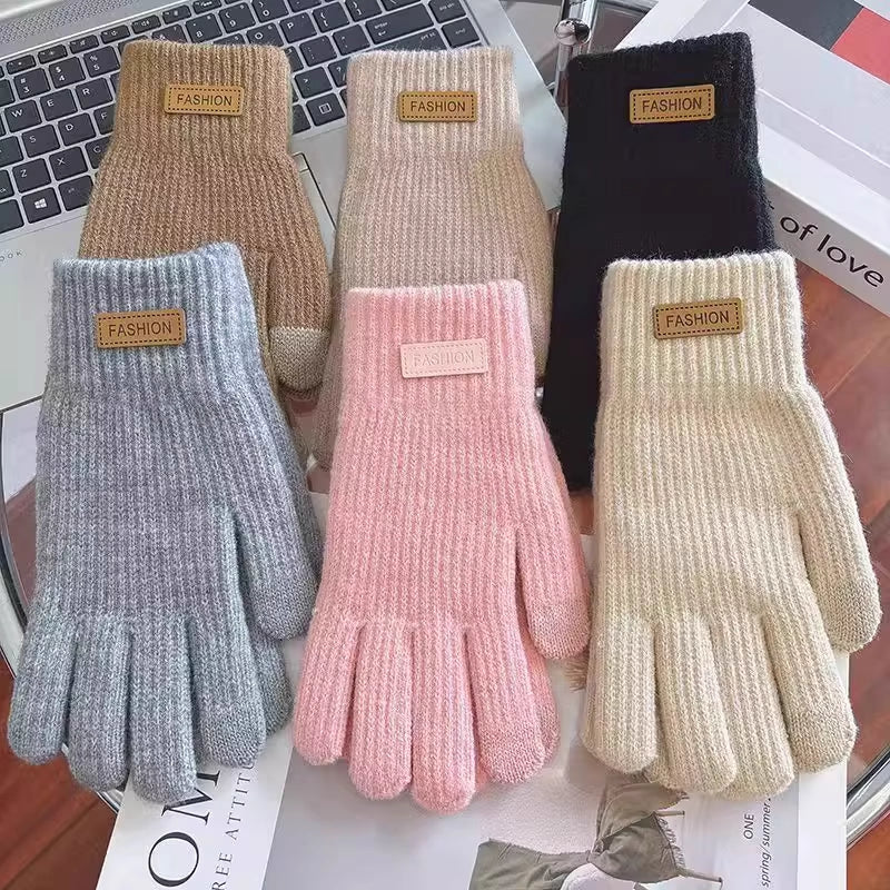 Assorted women’s ribbed knit touchscreen gloves in multiple colors with label tags