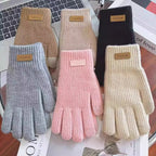 Assorted women’s ribbed knit touchscreen gloves in multiple colors with label tags