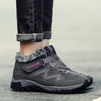 Dark gray snow boots with faux fur lining and hook-and-loop strap, lug sole