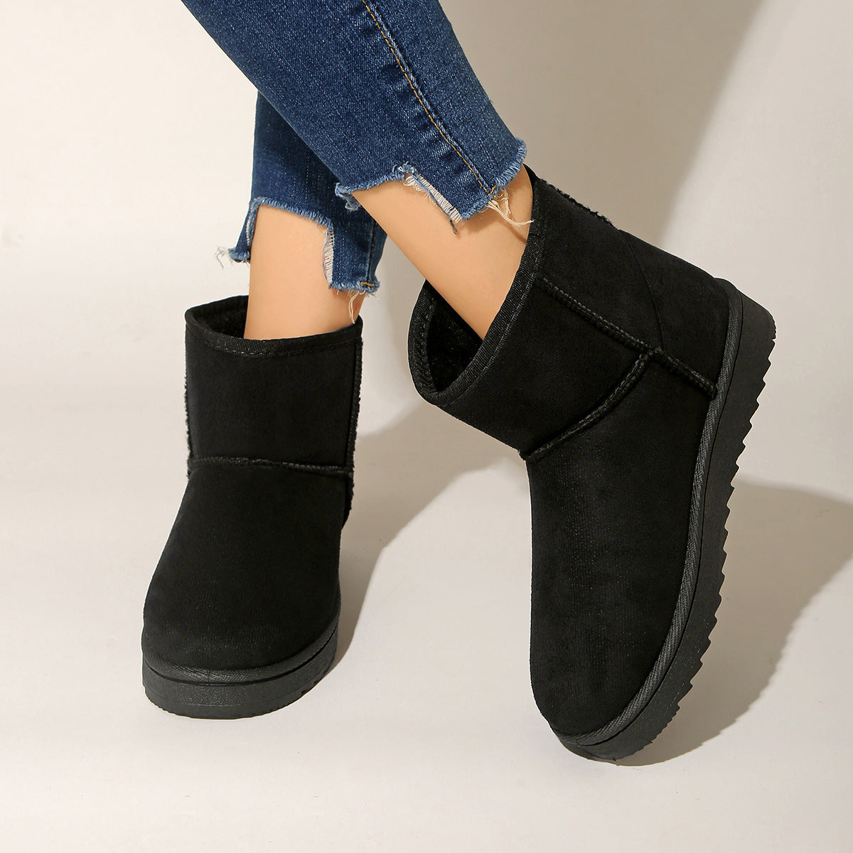 Black pull-on ankle boots with round toe, suede-look shaft and soft inner lining