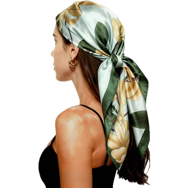 Light green satin head scarf with floral print, large square wrap tied at the side