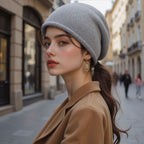 Women’s knitted beanie hat in light gray, folded cuff and soft knit texture.