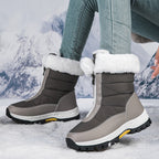 Gray mid-calf zip-up snow boots with faux fur cuffs and lug sole.