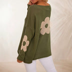 Oversized olive green knit sweater with floral motifs and drop shoulders