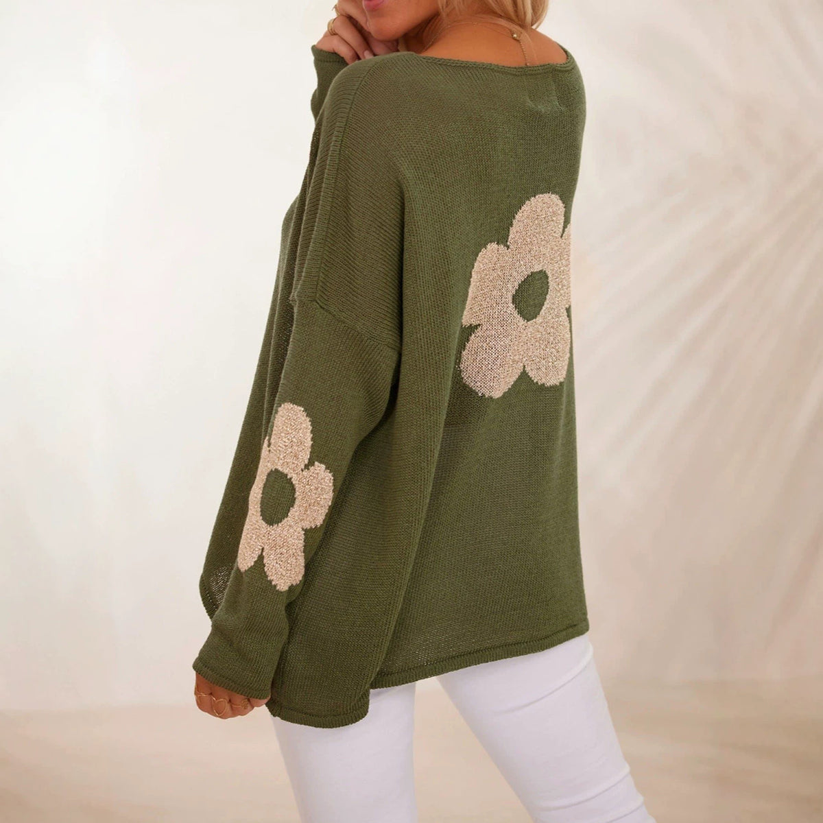 Oversized olive green knit sweater with floral motifs and drop shoulders
