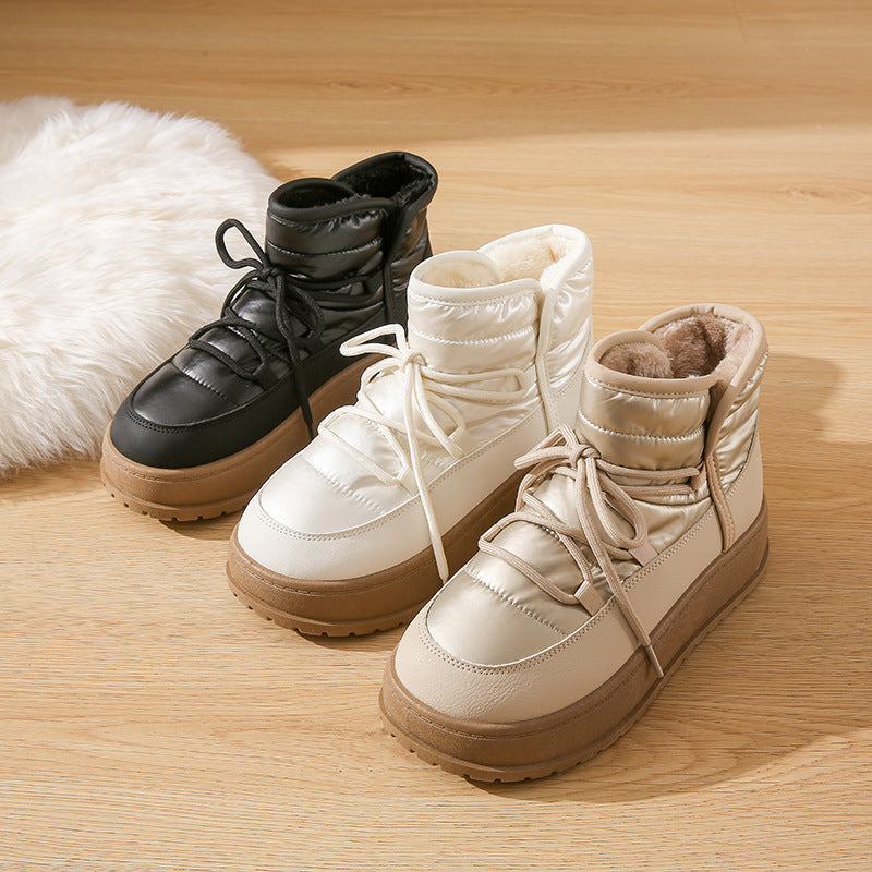 Fleece-lined lace-up winter snow boots in black and off-white with padded collars