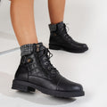 Women's black quilted combat boots with knit cuff, lace-up front and side zip