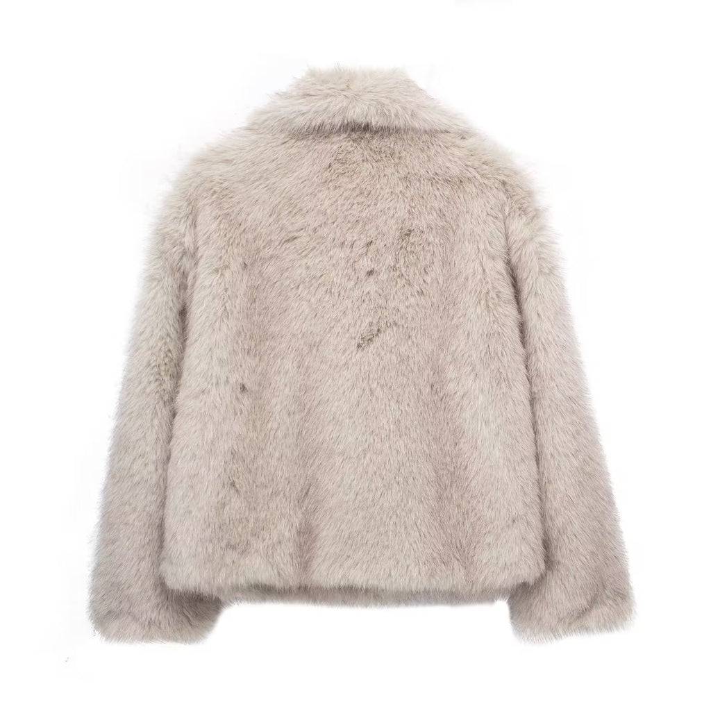 Light beige cropped faux fur jacket with long sleeves and stand collar.