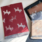 Red dog-print blanket scarf with fringe, shown beside folded color options