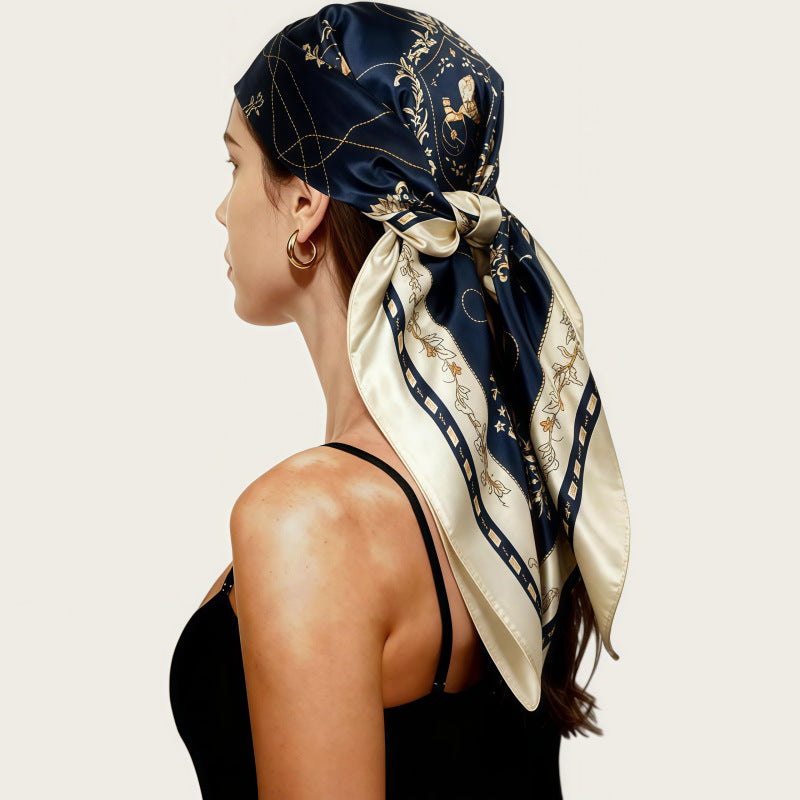 Navy satin head scarf with gold print, large square wrap tied at the side