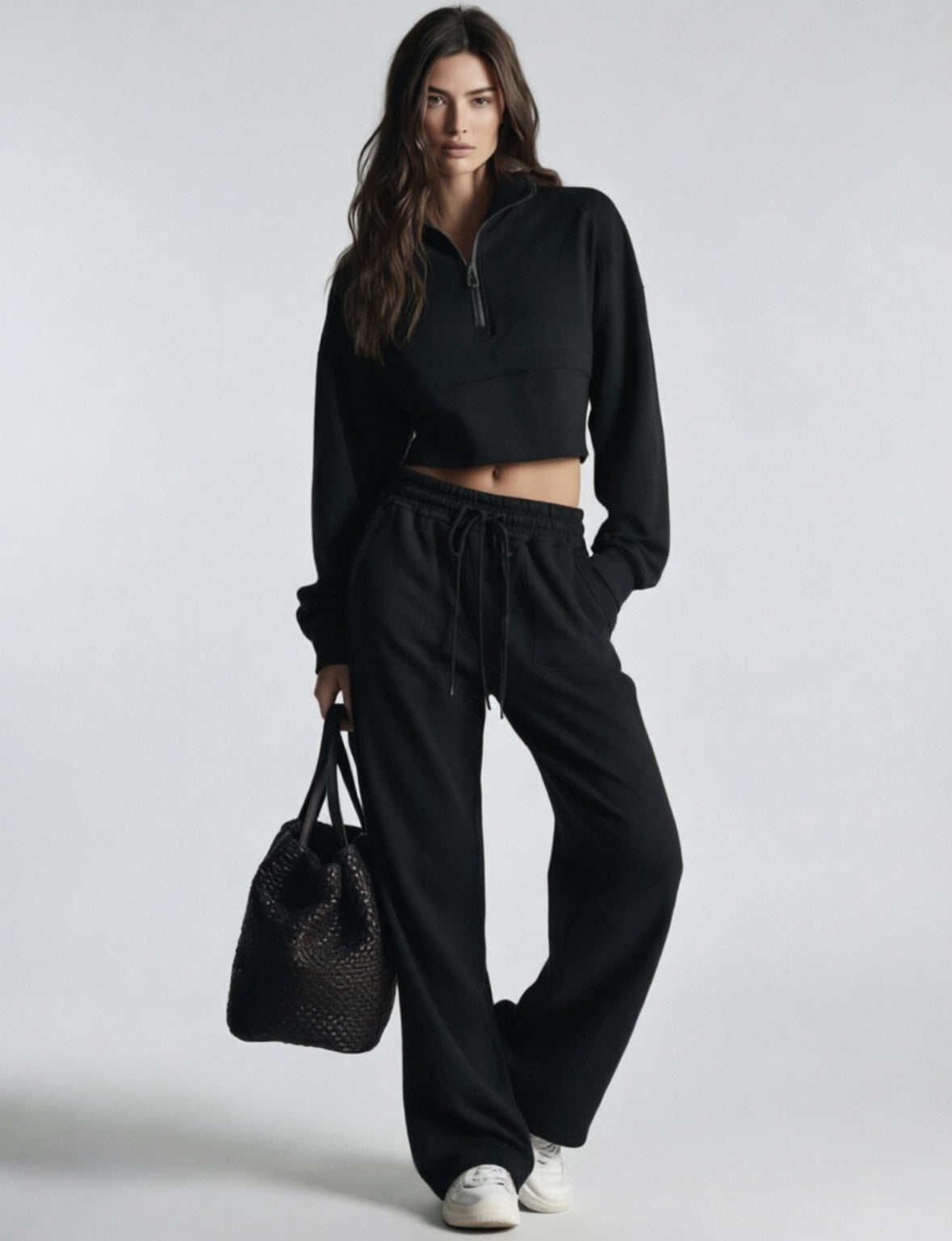 Black women's sweatsuit with cropped half-zip sweatshirt and wide-leg drawstring pants